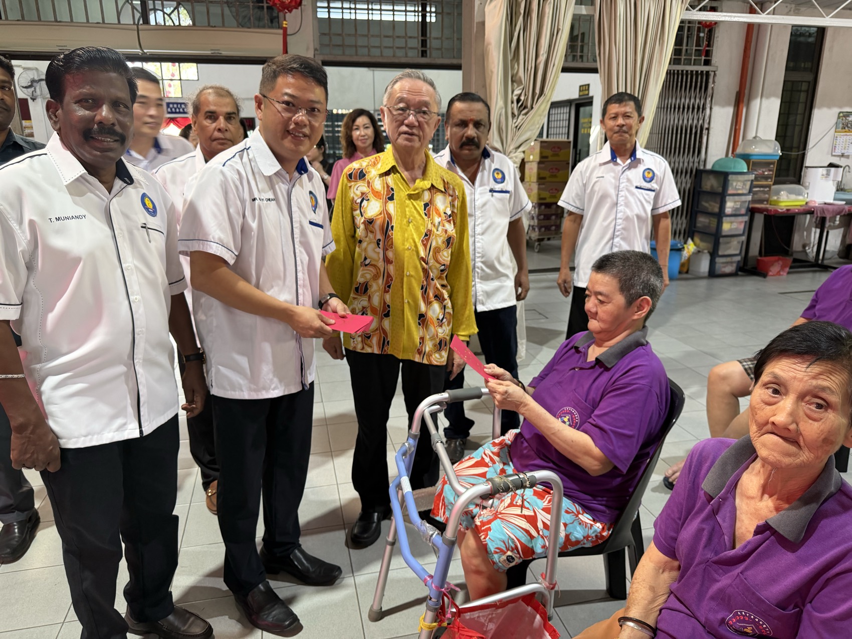 Handing over aid to residents at a care home visit
